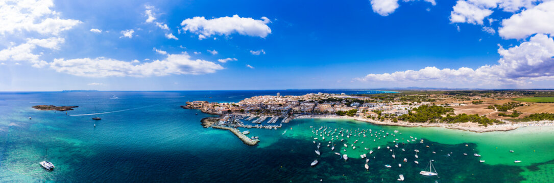 Spain, Balearic Islands, Colonia de Sant Jordi, Aerial panorama of Mediterranean Sea and coastal town in summer