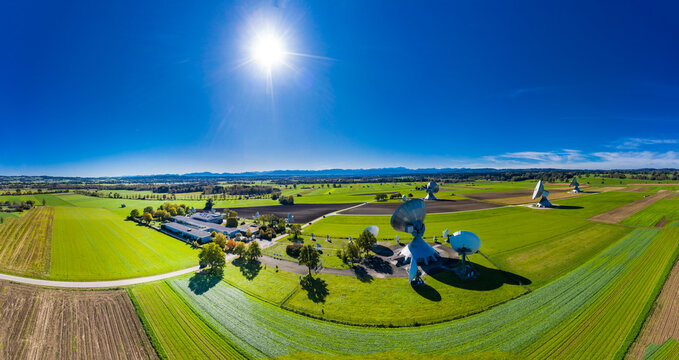 Germany, Bavaria, Aerial view of large parabolic antennas of the earth station Raisting and green fields