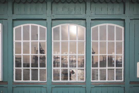 Germany, Hamburg, Ovelgonne, Port on river Elbe reflected in window