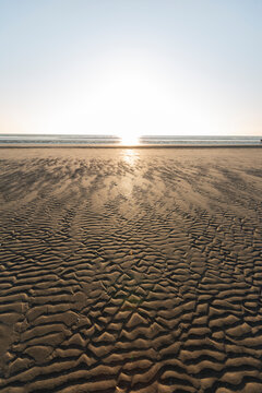 Denmark, Romo, Rippled beach at sunset