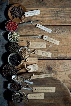Name tags attached to bowls, ladles and scoops of various peppers