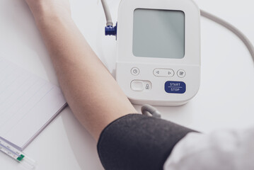 Man measures blood pressure. arterial hypotension. hand and tonometer close up. Healthcare and medical concept