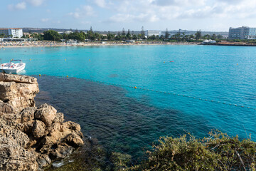 Fototapeta premium Crystal clear blue water of Mediterranean sea on Nissi beach in Ayia Napa, Cyprus