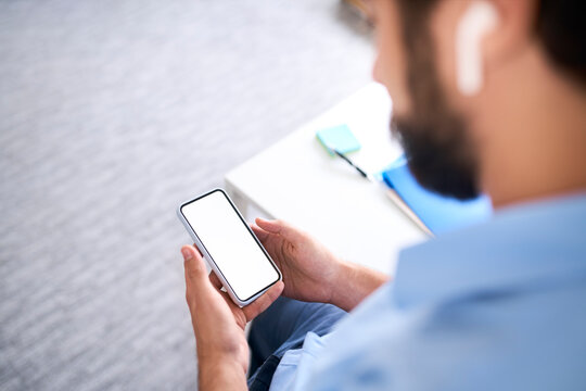 Businessman using a smartphone in his office