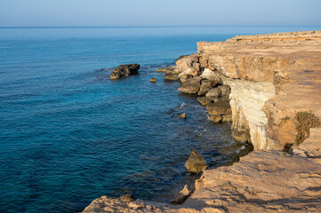 Fototapeta na wymiar National park Cape Greko, view on natural sea caves and turquoise water of Mediterranean Sea, Cyprus