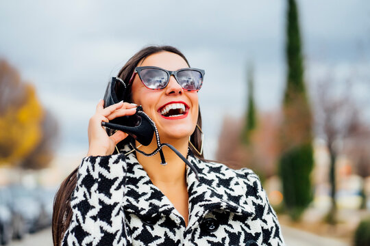 Businesswoman talking on the phone with a shoe
