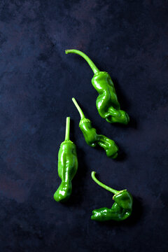 Green peperonis aon dark background