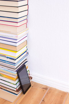 Many books and e-book reader, copy space