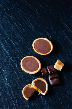 Cocolate caramel tartlets on black slate