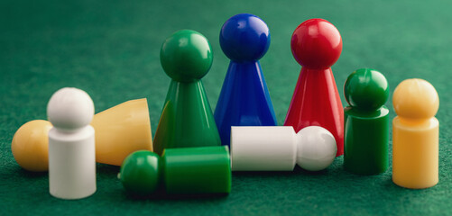 Colored board game figures with dice. Board games concept