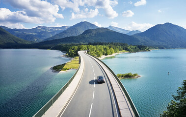 Aerial view of a car crossing a bridge, Sylvenstein Dam, Bavaria, Germany