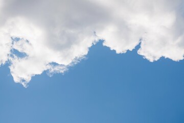 Big white clouds on clear blue sky, copy space