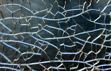 Large cracks in the glass, lit by the sun