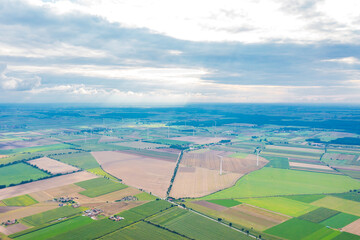 beautiful view from a great height on colorful fields, against the background of the summer blue...