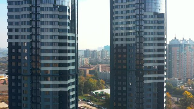 A span between two skyscrapers and a view of the city in autumn