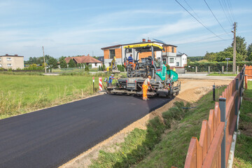 Construction of a country street with an asphalt surface