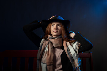 Fototapeta premium Girl with scarf and hat in studio