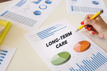 Financial concept about LONG-TERM CARE with sign on the financial document.