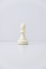 isolated white bishop chess piece on white background.