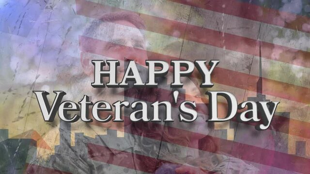 Animation of happy veteran's day text over caucasian male soldier with his wife and american flag
