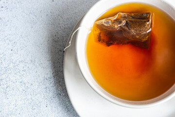 Overhead view of a tea bag brewing in a cup