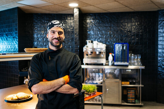 Portrait of smiling chef in restaurant kitchen