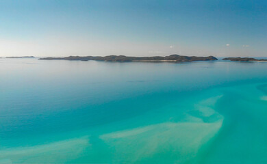 Fototapeta premium Whitehaven Beach, Queensland. Sunset panoramic aerial view from drone prospective