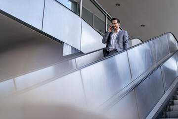 Businessman on cell phone in the city