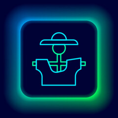 Glowing neon line Scarecrow icon isolated on black background. Colorful outline concept. Vector