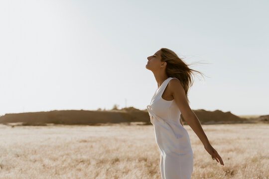 Female traveller enjoying the wind