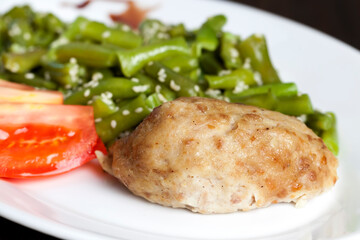baked asparagus beans with sesame seeds and meat cutlet