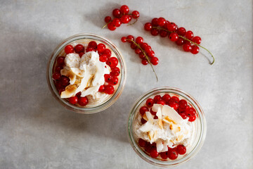Jars of gluten free amaranth mousse with red currant berries