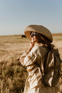 Female traveller with straw hat and sunglasses