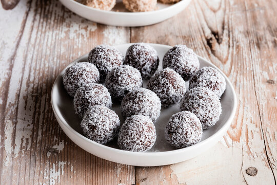 Vegan protein balls with millet, coconut, cocoa and nuts