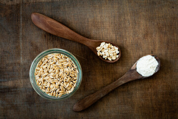 Ancient grains, Einkorn Weat in glas jar as grain, flakes and flour