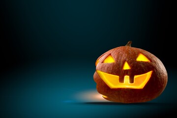 A scary pumpkin lantern with evil grin for the Halloween concept.