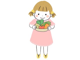 カゴにたっぷり採れたて野菜を収穫したかわいい笑顔の女の子