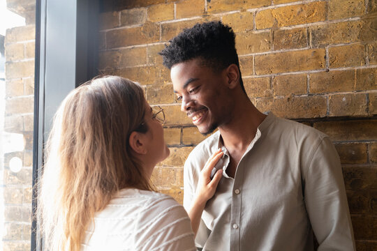 Portrait of happy young man face to face with his girlfriend