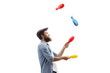 Profile shot of a juggler juggling with clubs © Ljupco Smokovski