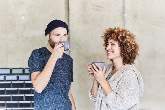 Man and woman drinking coffee together