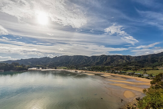 New Zealand, Tasman Region, Sun shining over Golden Bay and Ligar Bay Beach