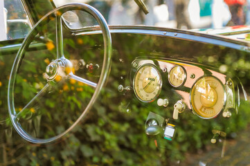Cockpit of an oldtimer, reflection on car window