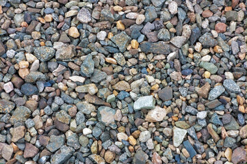 Crushed granite texture close-up. Background made of a closeup of a pile of crushed stone.