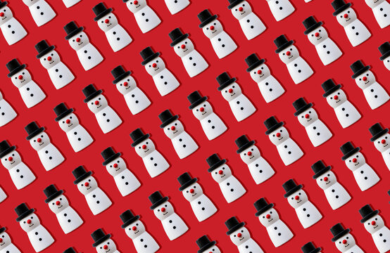 Christmas Snowmen Pattern Against Red Background