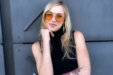 Portrait of happy young woman  wearing sunglasses