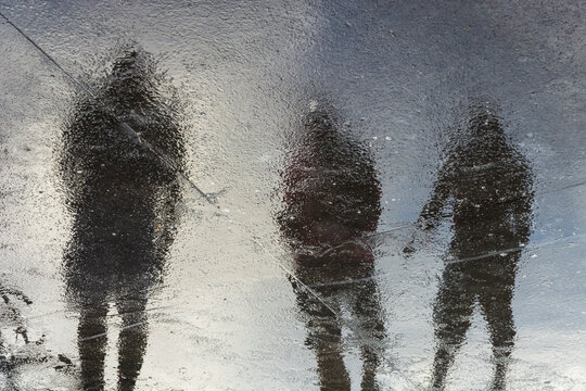 Fototapeta Reflection of fishermen in the external area of the colony where fish are sold and kept.