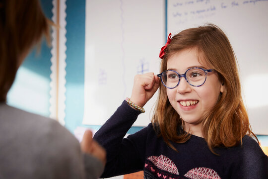 Portrait of smiling girl in a class during a lesson