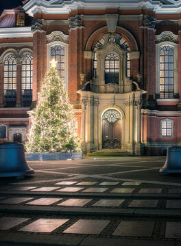 Germany, Hamburg, Christmas tree glowing in front of Saint Michaels Church at night