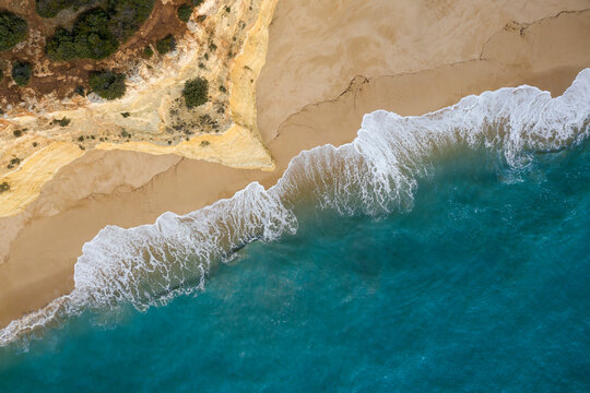 Portugal, Algarve, Lagoa, Drone view of cliff and beach at Praia da Malhada do Baraco