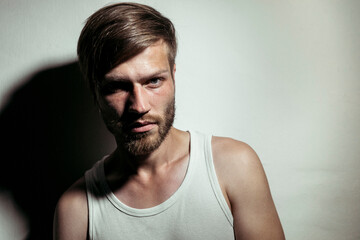 Handsome man beard staring against white background